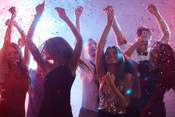 depositphotos_130592304-stock-photo-ecstatic-friends-dancing-in-confetti